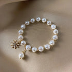 Bracelet avec pendentif en or blanc, perle et tournesol