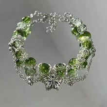 Bracelet vintage avec papillon argenté et perles vertes