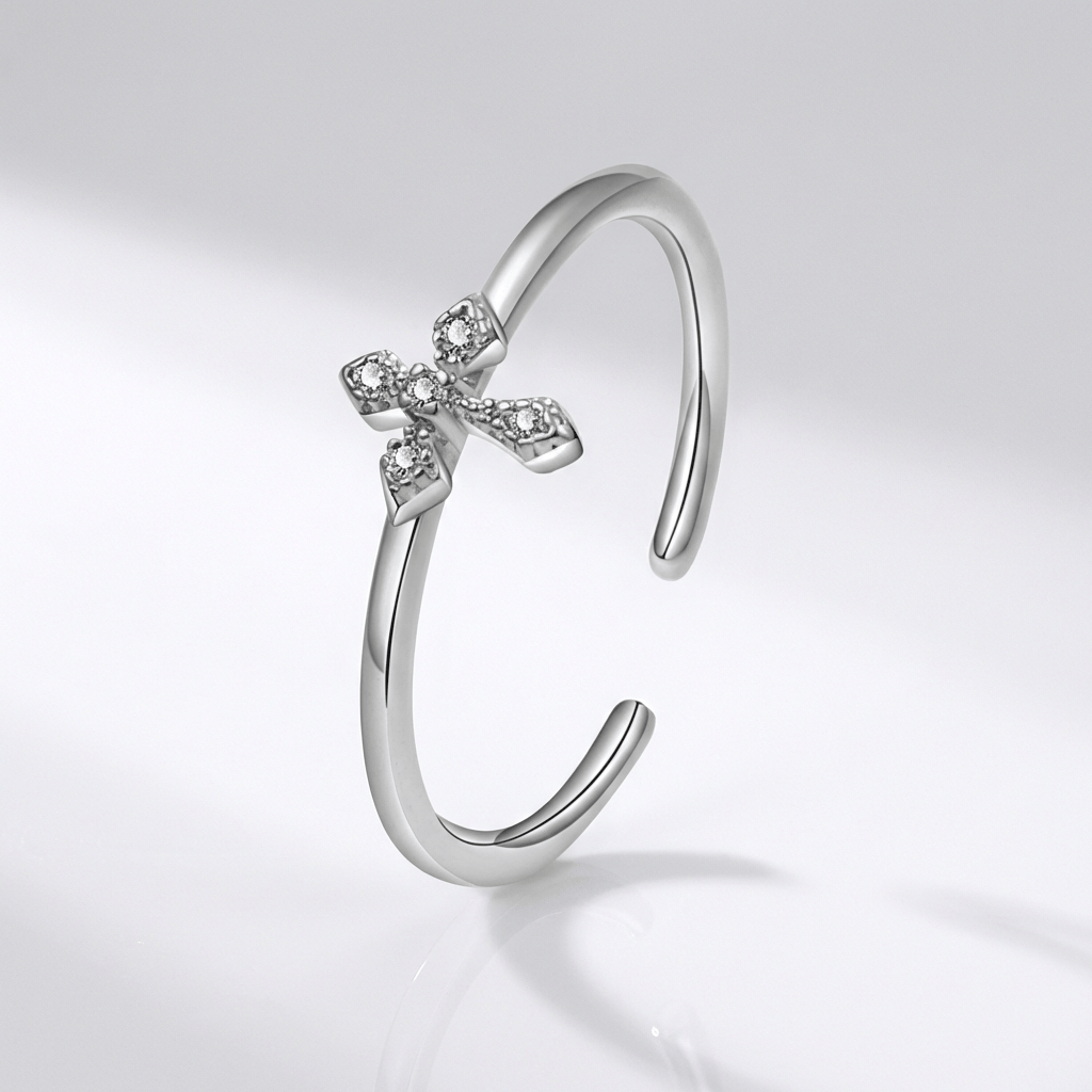 BAGUE BRILLANTE EN CROIX ARGENTÉE